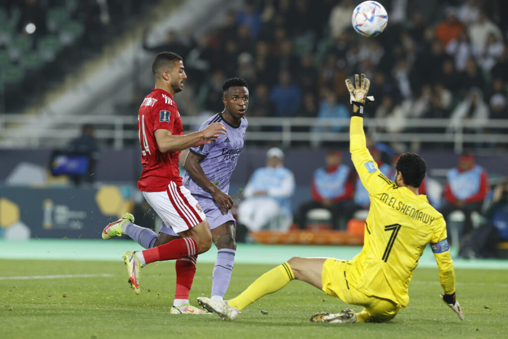 Real Madrid's Vinicius Jr. (C) beats Al Ahly goalkeeper Mohamed El Shenawy