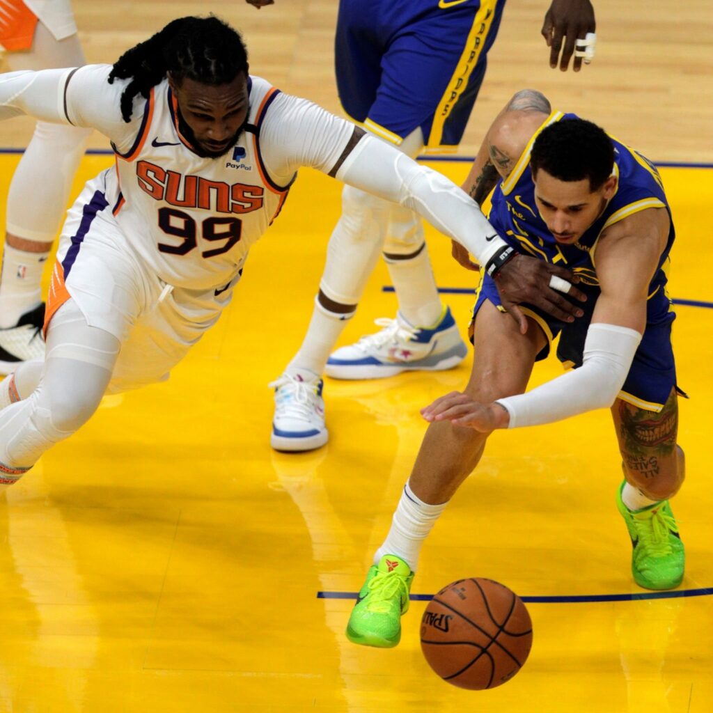 Juan Toscano Anderson (95) and Jae Crowder (99)